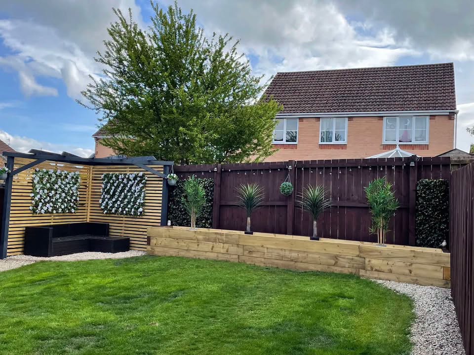 Landscaped garden with mature trees and outdoor living space